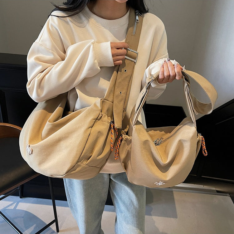 致青春 | 大容量餃子包包女2025新款潮流男女旅行包休閒通勤單肩斜挎包「2505-126」25.02-3