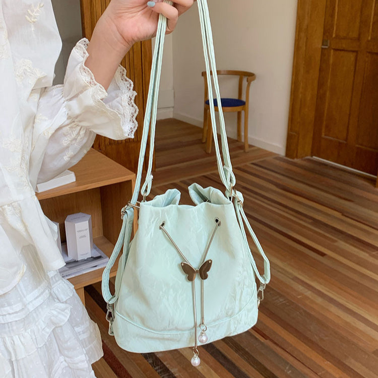 日韓流行|薄荷曼波綠雙肩包包女式2024新款韓國蝴蝶拉繩水桶包百搭ins單肩腋下包「9450#-2」24.08-1