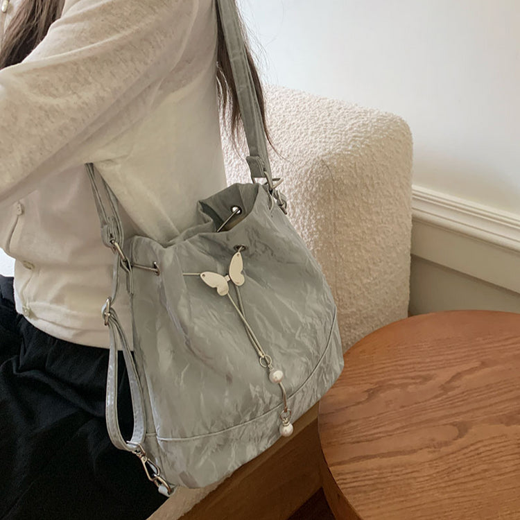 日韓流行|薄荷曼波綠雙肩包包女式2024新款韓國蝴蝶拉繩水桶包百搭ins單肩腋下包「9450#-2」24.08-1