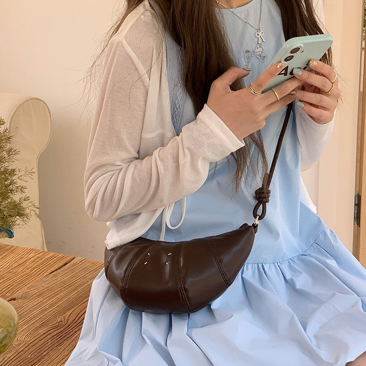 日韓流行 | 韓國小眾設計包包女2025新款夏季簡約可頌牛角包百搭休閒斜背包「9574#」25.04-2