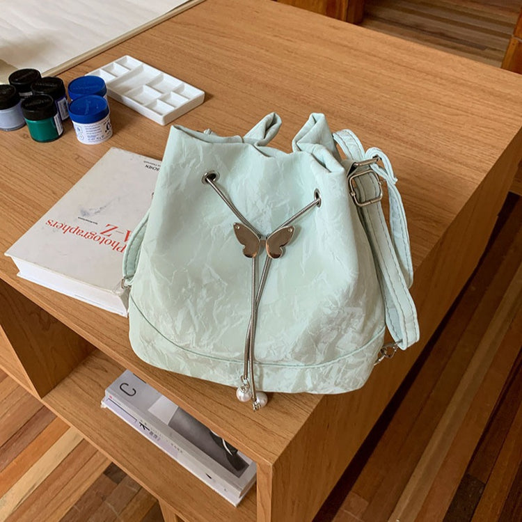 日韓流行|薄荷曼波綠雙肩包包女式2024新款韓國蝴蝶拉繩水桶包百搭ins單肩腋下包「9450#-2」24.08-1